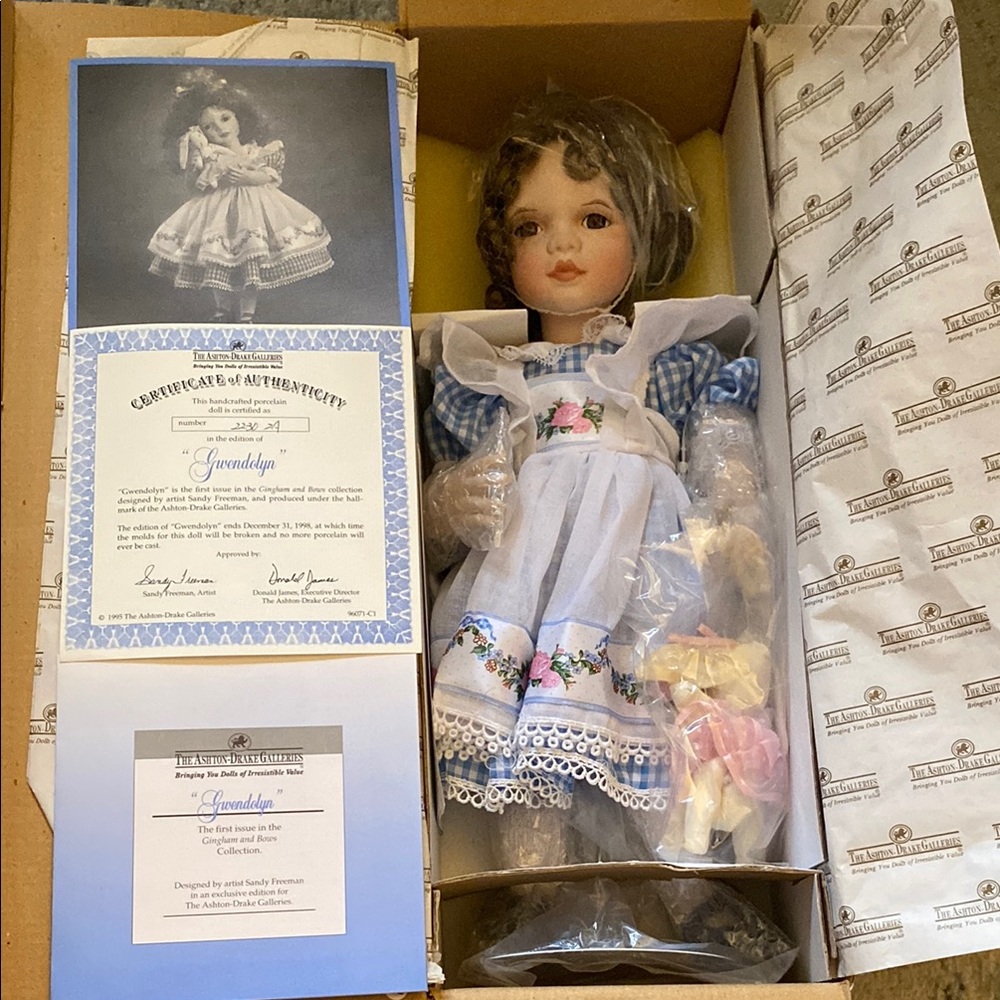 Porcelain Doll with Blue Dress and Floral Accents